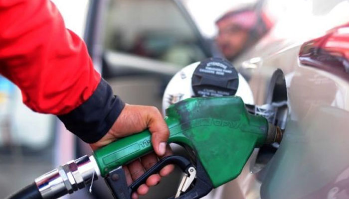 A man filling car tank with fuel. Photo— AFP