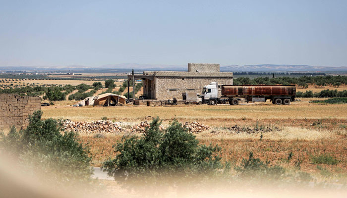 This picture taken on June 16, 2022 shows a view of a building where US coalition forces conducted an overnight airborne operation in the village of Hmeirah in the Ghandoura district in the north of Syrias Aleppo province. — AFP