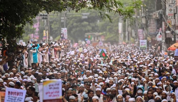 Bangladesh Islamist parties activists and supporters hold placards as they shout anti-India slogans during a demonstration in Dhaka on June 10, 2022. — AFP/File