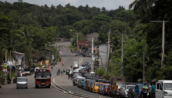 Vehicles queue to buy petrol at a fuel station in Gonapola town, on the outskirts of Colombo, Sri Lanka, May 23, 2022. — Reuters