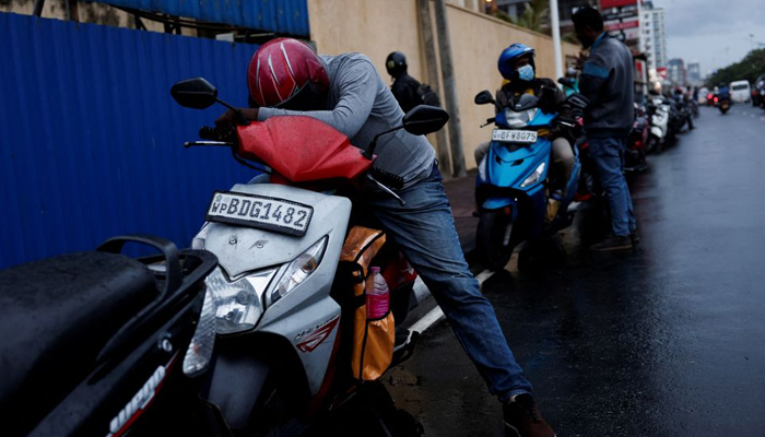 A man waits in a queue to buy petrol due to fuel shortage, amid the countrys economic crisis, in Colombo, Sri Lanka, June 16, 2022. — Reuters