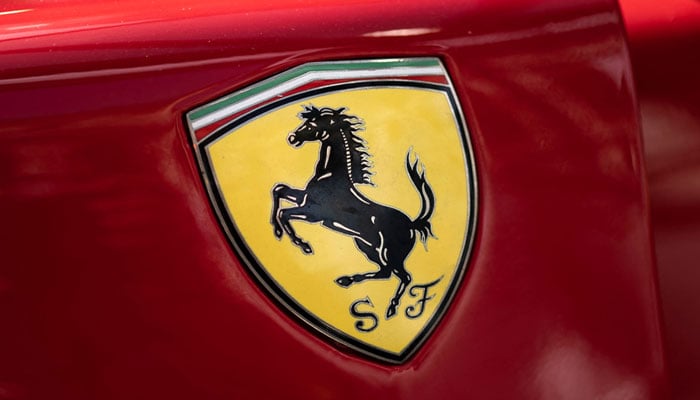 The logo of Italian manufacturer of luxury sports cars Ferrari is pictured on a car in Modena, Northern Italy, during the Motor Valley Fest, the fair of luxury and sport brands of cars and motorbikes factories based in the Emilia-Romagna region, on May 27, 2022. — AFP/File