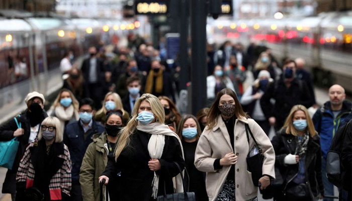 People walk along a platform at Kings Cross train station during morning rush hour, amid the coronavirus disease (COVID-19) outbreak in London, Britain, December 1, 2021. — Reuters/File
