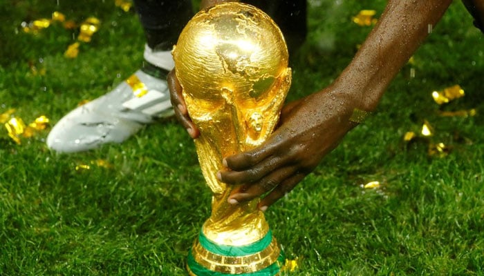 Soccer Football - World Cup - Final - France v Croatia - Luzhniki Stadium, Moscow, Russia - July 15, 2018 General view of the trophy as France celebrate after winning the World Cup. — Reuters/File