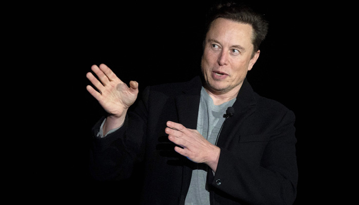 In this file photo taken on February 10, 2022 Elon Musk gestures as he speaks during a press conference at SpaceXs Starbase facility near Boca Chica Village in South Texas.-AFP