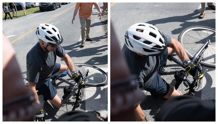 US President Joe Biden falls off his bicycle as he approaches well-wishers following a bike ride at Gordon´s Pond State Park in Rehoboth Beach, Delaware, on June 18, 2022. — AFP