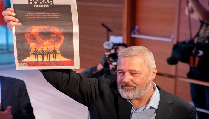 Dmitry Muratov holds a copy of his newspaper the Novaya Gazeta after his 2021 Nobel Peace Prize medal sold for 103.5 Million by Heritage Auctions in New York City, New York, U.S., June 20, 2022.—Reuters