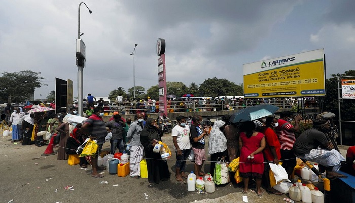 People stand in a long queue to buy kerosene oil due to shortage of domestic gas as a result of countrys economic crisis, at a fuel station in Colombo, Sri Lanka March 18, 2022.—Reuters