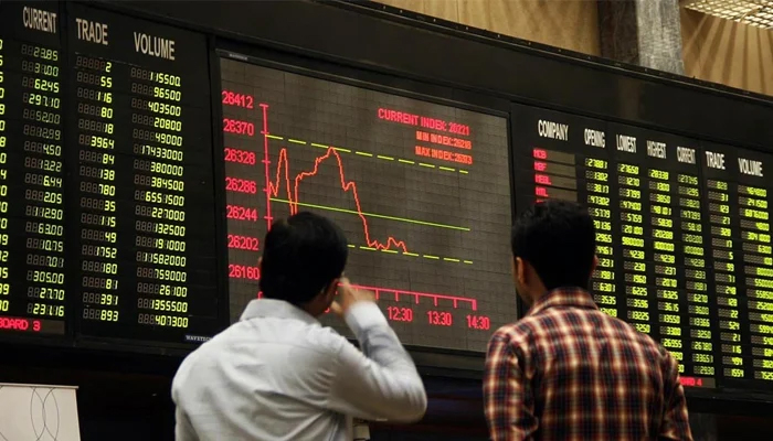 Investors can be seen looking at the stock board at the Pakistan Stock Exchange. — AFP/File