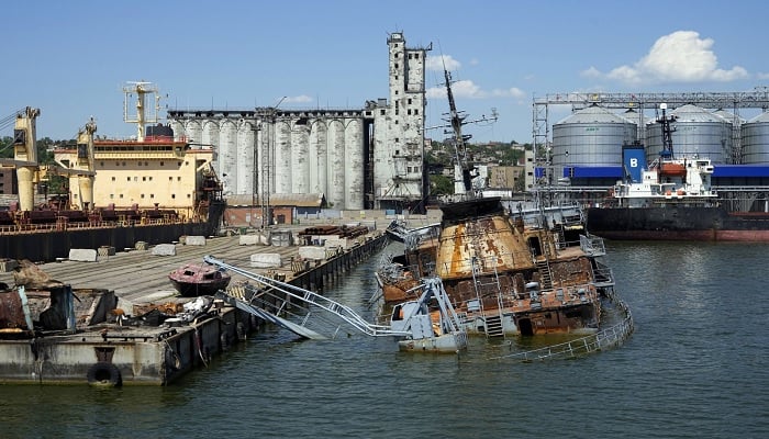 A sunken Ukrainian warship is seen near a pier with grain storage in the background at an area of the Mariupol Sea Port, eastern Ukraine, June 12, 2022.—AP