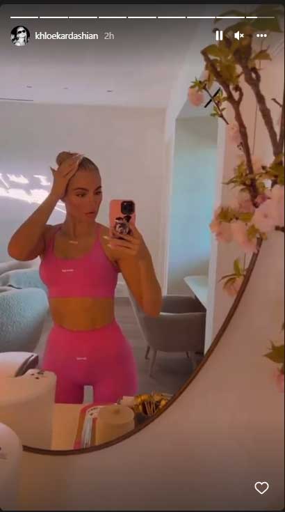 Khloe Kardashian teases her new beau as she puts gym-honed abs on display in hot pink crop top