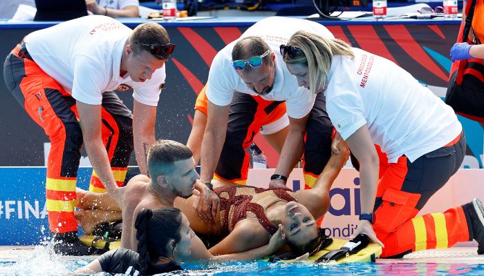 Artistic Swimming - FINA World Championships - Alfred Hajos Swimming Complex, Budapest, Hungary - June 22, 2022 Anita Alvarez of the U.S. receives medical attention during the womens solo free final.—Reuters