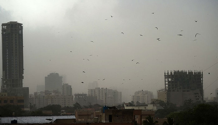 A general view shows Karachi on May 18 during a dust storm. — AFP
