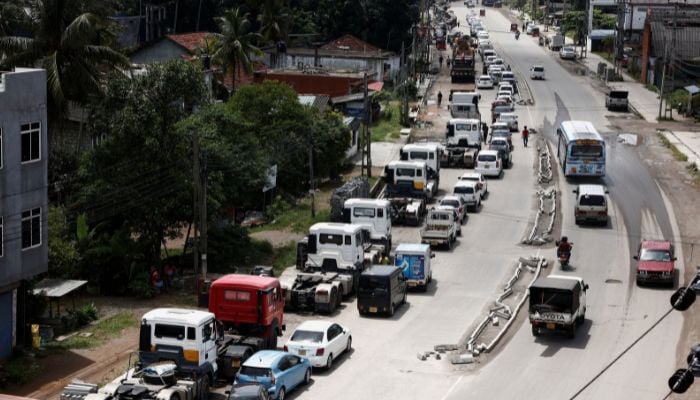 Vehicles queue for diesel and petrol as they wait for a bowser since yesterday, amid the countrys economic crisis, in Colombo, Sri Lanka, June 23, 2022.—Reuters