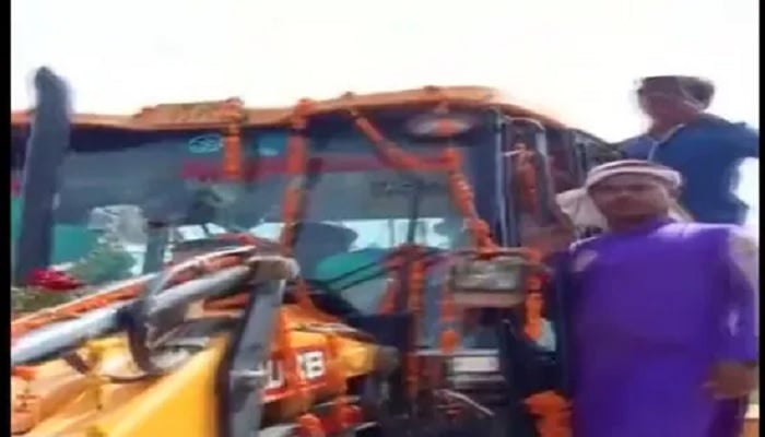 Grooms wedding procession on a bulldozer.—Screengrab via Twitter/ANI