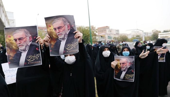 Protesters hold the pictures of Mohsen Fakhrizadeh, Irans top nuclear scientist, during a demonstration against his killing in Tehran, Iran, November 28, 2020. — Reuters