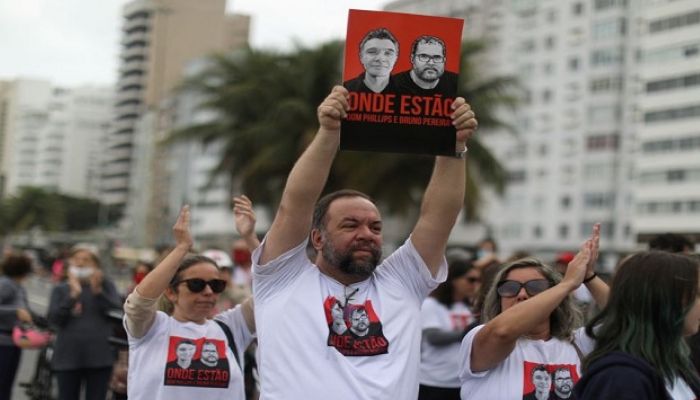 Relatives of British journalist Dom Phillips wife hold placards during a protest following the Amazon disappearance of Phillips and indigenous expert Bruno Araujo Pereira, at Copacabana beach, Rio de Janeiro, Brazil June 12, 2022. — Reuters