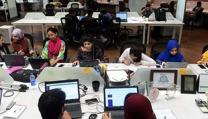 Young women work at their stations at the National Incubation Centre (NIC), a start-up incubator on May 24, 2019. — AFP/File