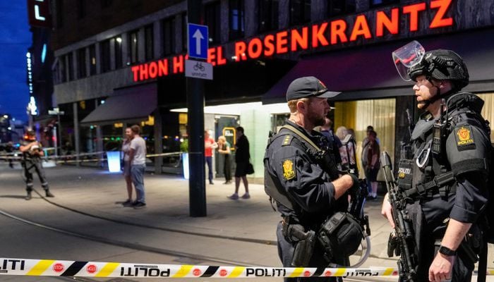 Security forces stand at the site where several people were injured during a shooting outside the London pub in central Oslo, Norway June 25, 2022. Photo— Javad Parsa/NTB/via REUTERS
