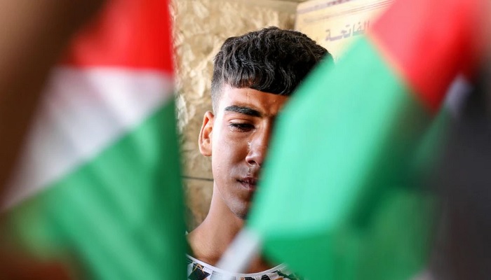 A friend of Palestinian teen Ghaith Yamen, who was killed during clashes with Israeli forces, mourns during his funeral in Nablus, in the Israeli-occupied West Bank May 25, 2022.—Reuters