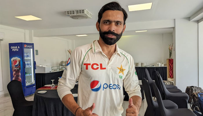 Fawad Alam dressed in Test kit poses for a picture with thumbs up. — PCB