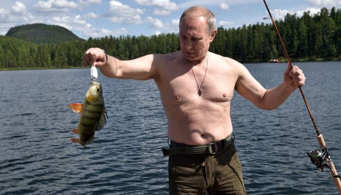 Russian President Vladimir Putin holds a fish he caught during the hunting and fishing trip which took place on August 1-3 in the republic of Tyva in southern Siberia, Russia, in this photo released by the Kremlin on August 5, 2017. — Reuters