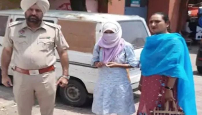 Woman caught by Indian police at the Attari Border in Amritsar while trying to cross over to reach Pakistan.—Screengrab via Youtube/Tribune India