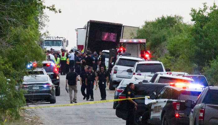 Law enforcement officers work at the scene where people were found dead inside a trailer truck in San Antonio, Texas, US June 27, 2022. Photo— REUTERS/Kaylee Greenlee Beal