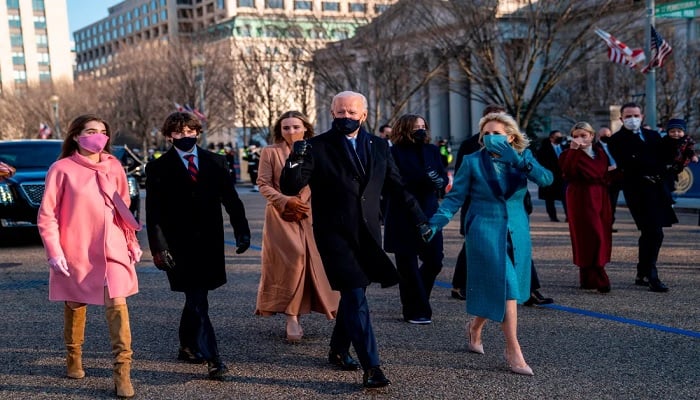 President Joe Biden and first lady Jill Biden walk along Pennsylvania Avenue in front of the White House during Inaugural celebrations, on January 20, 2021 with family members after US President Biden was sworn in as the 46th President of the United States.—AFP