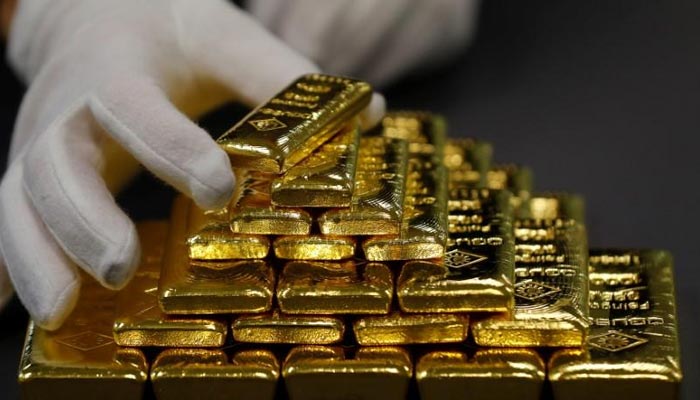 An employee sorts gold bars in the Austrian Gold and Silver Separating Plant Oegussa in Vienna, Austria, December 15, 2017. — Reuters/File