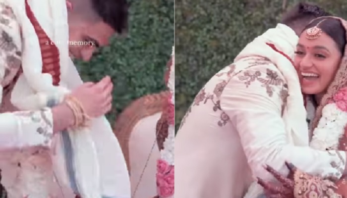 Groom bends down to touch brides feet. — Screengrab via Instagram/@ditigoradia