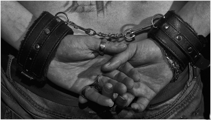 Image showing a handcuffed persons hands. — Pixabay