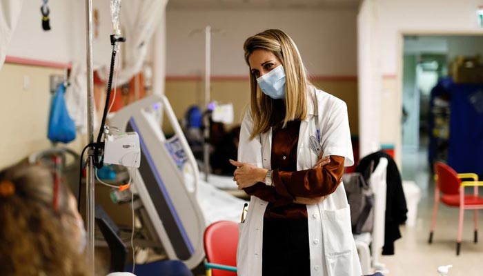 Liat Ashkenazi-Hoffnung, who heads the post-coronavirus disease (COVID-19) clinic at Schneider Childrens Medical Center of Israel, speaks with the mother of Noa, a 10-year-old Israeli girl suffering from Long Covid, in Petah Tikva, Israel December 6, 2021. — Reuters/File