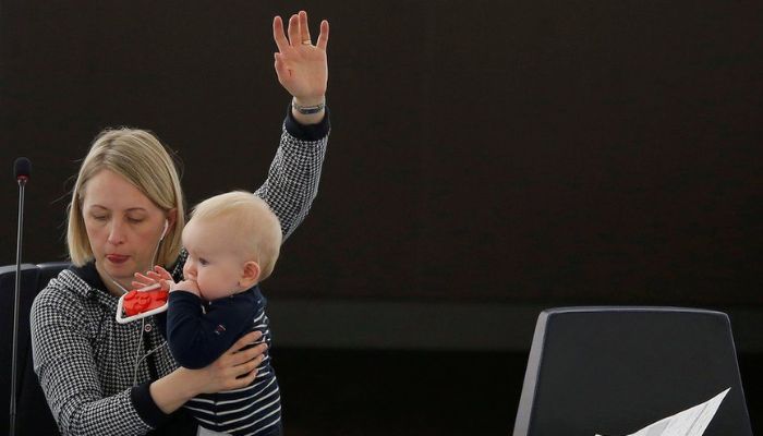 A photo of Swedish MEP Jytte Guteland with her young son went viral on social media in March 2017.—Reuters
