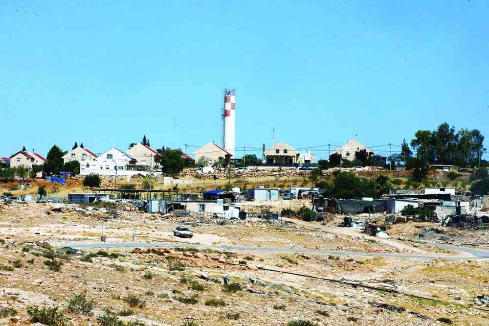 An Israeli settlement overlooks the Masafer Yatta hamlet. Photo by: Alaa Hathaleen