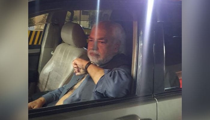 Senior journalist Ayaz Amir pictured in his car after the attack on him. — Twitter/Ayaz Amir