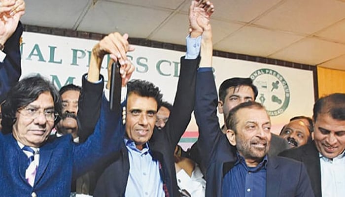 Farooq Sattar, Khalid Maqbool Siddiqui and others join hands to express unity in this file photo.—Online