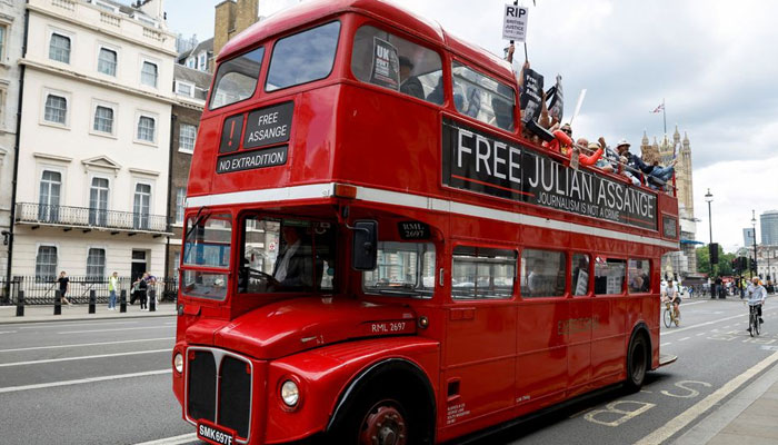 Protesters ride on a bus during a Free Assange demonstration to mark WikiLeaks founder Julian Assanges birthday, in London, Britain, July 1, 2022. — Reuters
