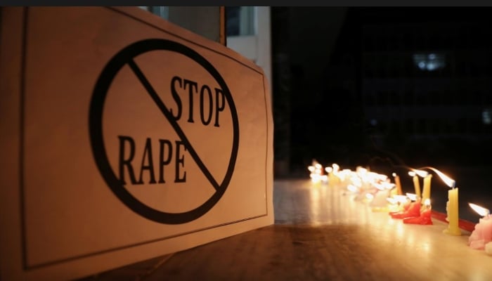 A poster is seen at a candle-lit march by the resident doctors and medical students from All India Institute Of Medical Sciences (AIIMS) to protest against the alleged rape and murder of a 27-year-old woman on the outskirts of Hyderabad, in New Delhi, India, December 3, 2019. — Reuters/Anushree Fadnavis