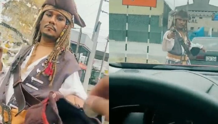 A beggar can be seen on the streets dressed up as Captain Jack Sparrow.—Screengrab via Twitter/@javroar