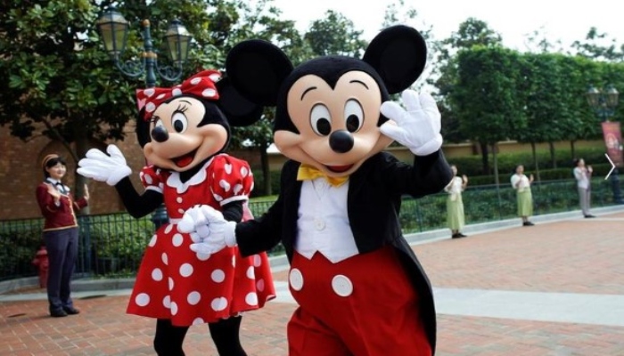 Disney characters Mickey Mouse and Minnie Mouse greet at Shanghai Disney Resort as the Shanghai Disneyland theme park reopens following a shutdown due to the coronavirus disease (COVID-19) outbreak, in Shanghai, China May 11, 2020. — Reuters/Aly Song