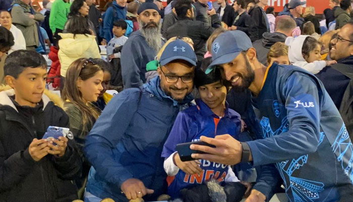 Indian fans take a picture with Pakistani Test opener Shan Masood. — Reporters