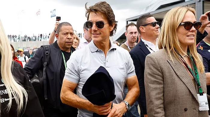 Tom Cruise turns cheerleader for Lewis Hamilton on 60th birthday at British F1 Grand Prix