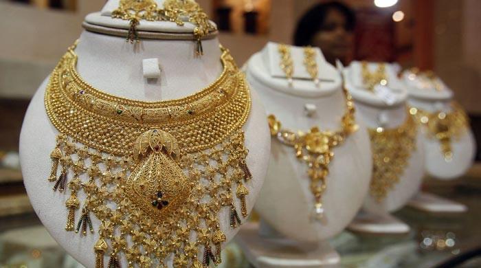 Gold loses its shine, prices drop by Rs300 per tola