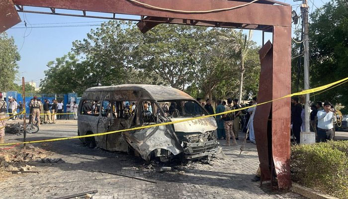 Image showing the remains of the affected van which was targeted in an explosion inside the premises of the University of Karachi, on April 26, 2022. — Geo News via Rana Javaid