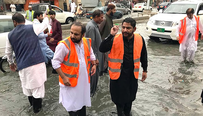 Administrator Metropolitan Corporation Abdul Jabbar Baloch carrying out an inspection at Saryab Road during heavy rains in Quetta, on July 4, 2022. — Online