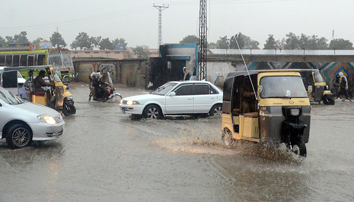 Motorists commute during heavy rains in Quetta, on July 4, 2022. — Online