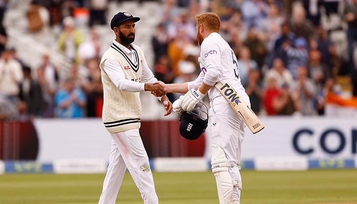 Cricket - Fifth Test - England v India - Edgbaston, Birmingham, Britain - July 5, 2022 Englands Jonny Bairstow shakes hands with Indias Cheteshwar Pujara after the match. — Reuters