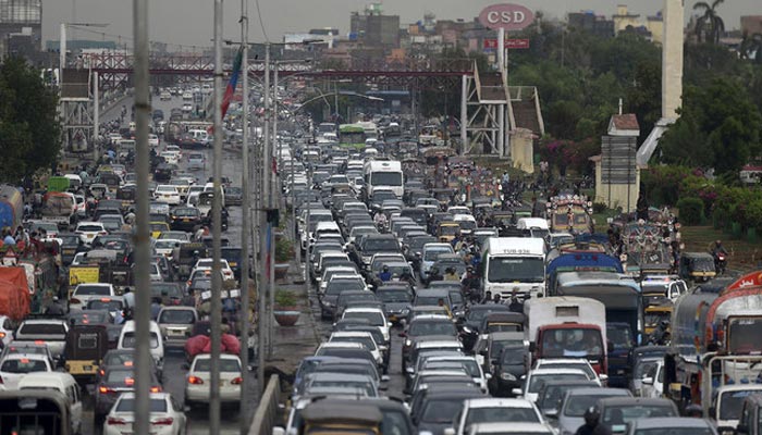 Commuters are seen on a busy road in Karachi, Pakistan, on July 6, 2020. — AFP/File