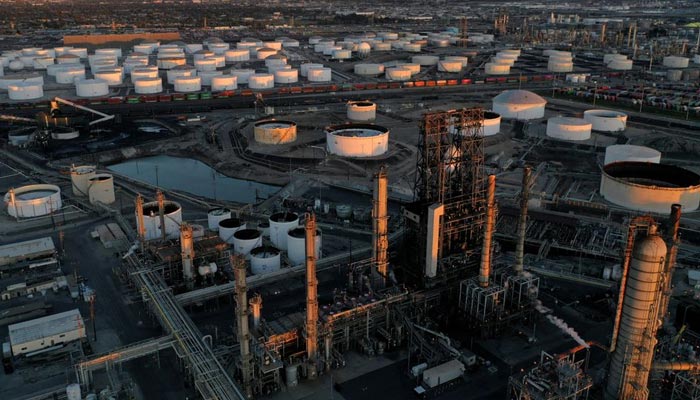 A view of the Phillips 66 Companys Los Angeles Refinery (foreground), which processes domestic and imported crude oil into gasoline, aviation and diesel fuels, and storage tanks for refined petroleum products at the Kinder Morgan Carson Terminal (background), at sunset in Carson, California, US, March 11, 2022. — Reuters/File